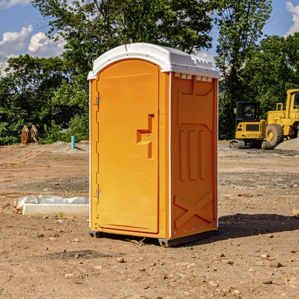 how often are the portable restrooms cleaned and serviced during a rental period in Trafford